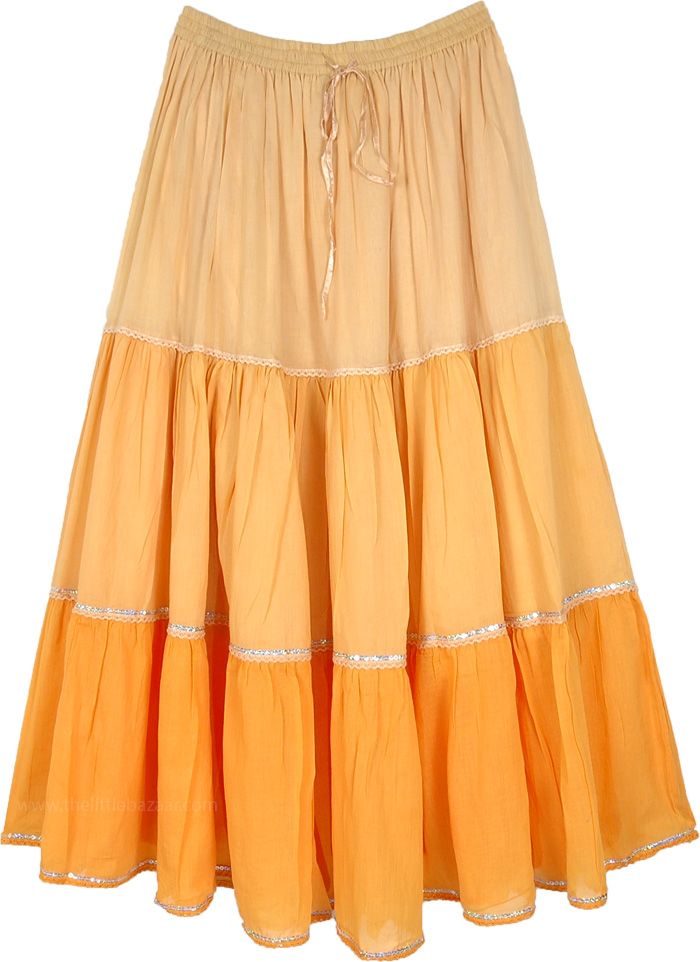 Walk on sunshine with this gorgeous orange-yellow-tiered cotton long skirt! Elegant and subtle, the piece features a tiered look and is accentuated with sequins and lace at the tier borders. The elastic waist is an easy pull-up style and has a ribbon drawstring to fix the size according to your preference. #tlb #Lace #XLPlus #Misses #MaxiSkirt #vacationclothing #beachwrap #Dance #bohemianfashion #SequinSkirt #PartySkirt Orange Tiered Maxi Skirt For Spring, Summer Yellow Tiered Skirt, Yellow Long Skirt, Yellow Tiered Summer Skirt, Orange Tiered Skirt, Yellow Bohemian Flared Skirt, Yellow Flowy Tiered Skirt, Flowy Tiered Orange Skirt, Long Skirt Elegant