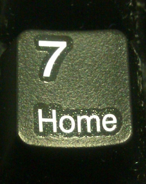 a close up of a keyboard with the number seven on it