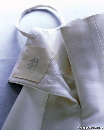 a close up of a white shirt with a tag on it