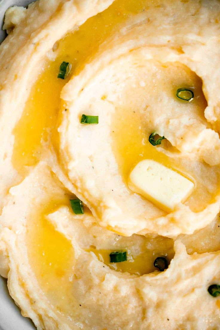 mashed potatoes with butter and chives in a bowl