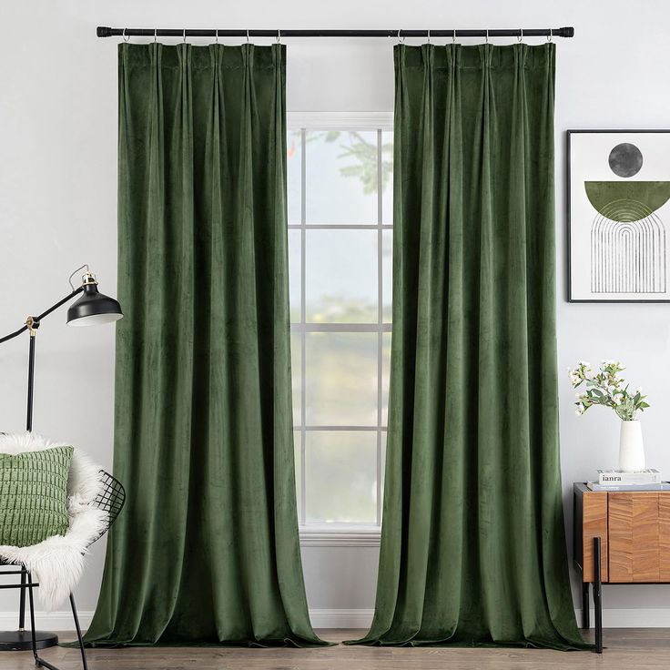 a green curtain hanging in front of a window