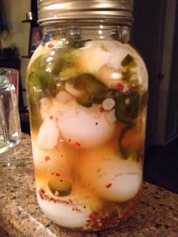 a jar filled with food sitting on top of a counter