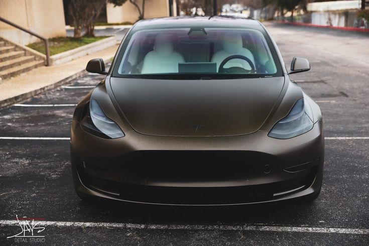 an electric car parked in a parking lot