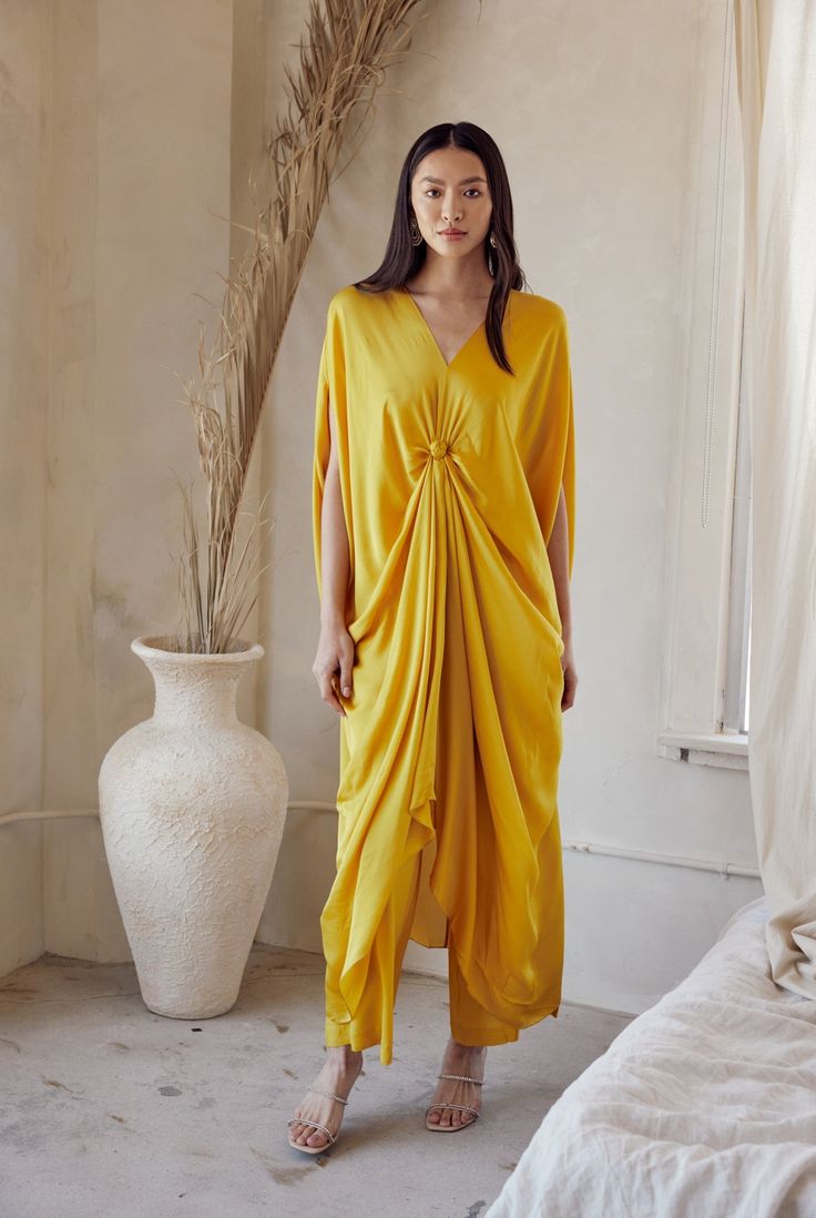 Celebrate in style with this eye-catching yellow silk draped kaftan set, boasting a relaxed fit that puts comfort first. Drape Coord Set, Kaftan For Haldi Function, Kaftan Designs 2024, Kaftan Aesthetic, Unique Kaftan Designs, Kaftan Dress Modern, Draped Kaftan, Turkish Kaftan, Yellow Kaftan