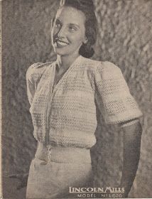 an old black and white photo of a smiling woman wearing a knitted top with short sleeves