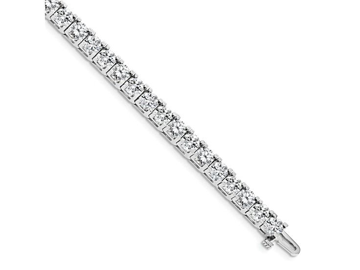 Rhodium over 14k white gold I1/G-H diamond tennis bracelet. Measures approximately 5/16 of an inch in width and has a box catch clasp. Diamonds weighs 17.094ctw. Luxury Tennis Bracelet With Channel Set For Formal Occasions, Luxury Channel Set Tennis Bracelet For Formal Occasions, Formal Diamond Tennis Bracelet Channel Set, White Gold Diamond Tennis Bracelet - Channel Set, White Gold Channel Set Tennis Bracelet For Anniversary, Formal Platinum Tennis Bracelet With Diamond Accents, Formal White Gold Diamond Bracelet Channel Set, Classic Channel Set Bracelet For Formal Occasions, White Gold Tennis Bracelet Channel Set For Wedding