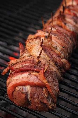 the meat is being cooked on the grill