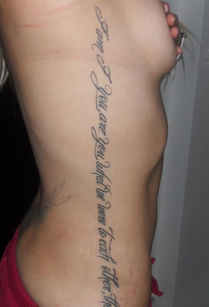 the back of a woman's lower body with writing on her stomach and chest