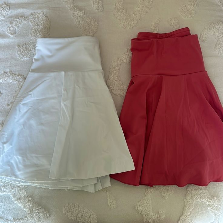 Both Never Worn Can Buy Both Or Just One The Pink Is Prettier In Person Never Worn Condition White Mini Skirt With Built-in Shorts, White Sports Skirt For Spring, Spring Sports White Skirt, White Stretch Lined Skort, White Stretch Skort With Lined Skirt, White Sports Skirt For Summer, White Sport Skirt For Summer, White Lined Skort For Athleisure, White Workout Skort With Elastic Waistband