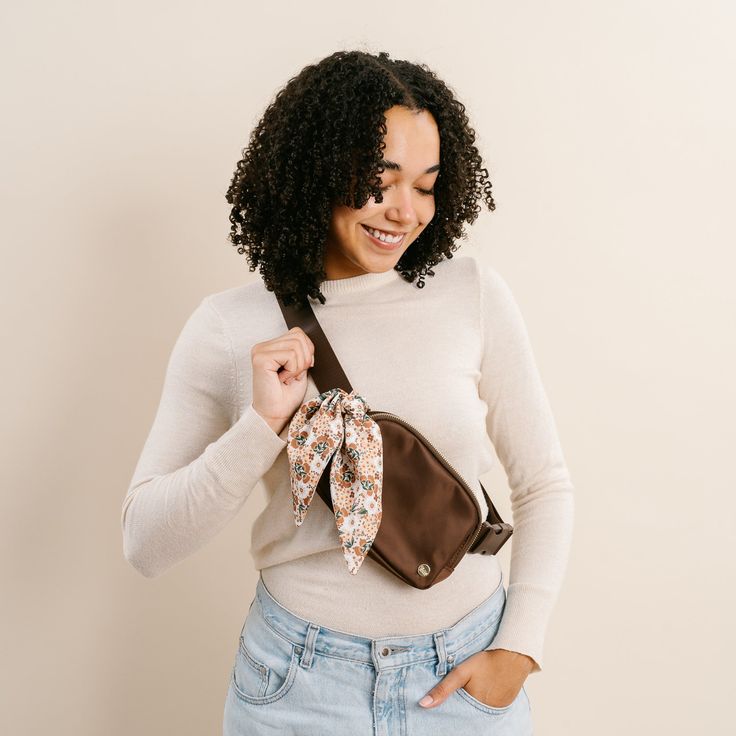 This awesome bag is All You Need to be hands free and carry all your essentials! Wear it two ways - cross your chest as a crossbody or around your waist like a fanny pack. The dreamy mocha brown color, pretty floral scarf, and gold hardware make it a great choice for any season and any style. The main compartment is sized just right for keys, wallet, sunnies, lippie, and a bit more without over loading yourself and has mesh pockets to keep things secure. A smaller pocket on the back is perfect t Brown Shoulder Bag For Spring On-the-go, On-the-go Brown Belt Bag With Adjustable Strap, Everyday Brown Belt Bag With Adjustable Strap, Brown Adjustable Strap Belt Bag For On-the-go, Brown Belt Bag With Adjustable Strap For On-the-go, Brown Crossbody Belt Bag For On-the-go, Versatile Brown Belt Bag For On-the-go, Casual Brown Belt Bag For Everyday Use, Versatile Brown Belt Bag For Mobile Phone