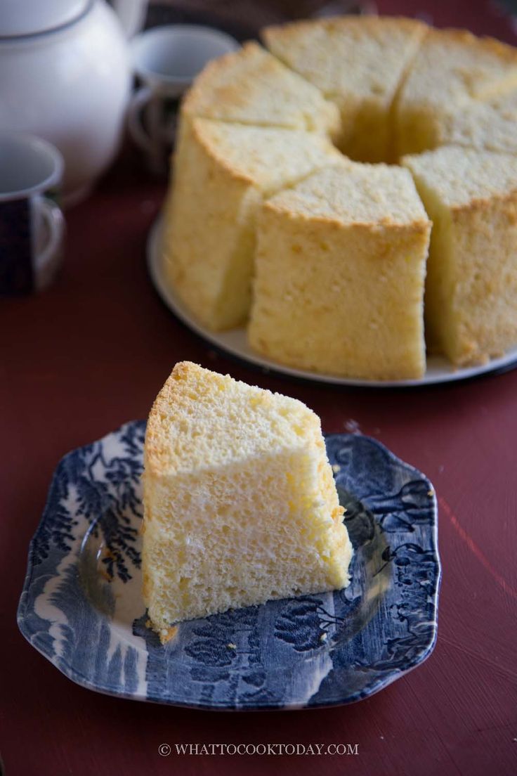 a piece of cake sitting on top of a plate next to a bunt cake