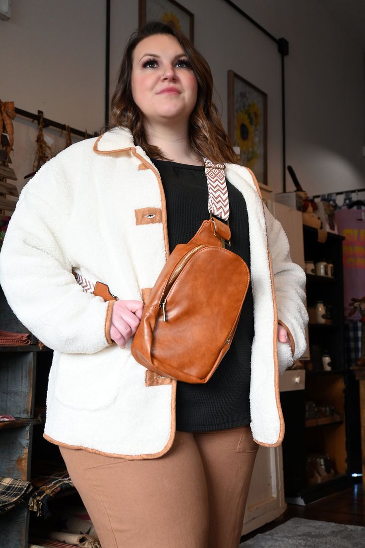 Crossbody Sling BagBrown and Black faux leather zippered crossbody bag with guitar style strap Brown Satchel Chest Bag With Zipper Closure, Brown Crossbody Chest Bag With Zipper Pocket, Brown Chest Shoulder Bag With Zipper Closure, Brown Crossbody Chest Bag With Cell Phone Pocket, Brown Crossbody Chest Bag For Everyday Use, Fall Shoulder Bag Backpack With Adjustable Strap, Faux Leather Crossbody Chest Bag, Faux Leather Crossbody Chest Bag For Everyday Use, Everyday Faux Leather Crossbody Chest Bag