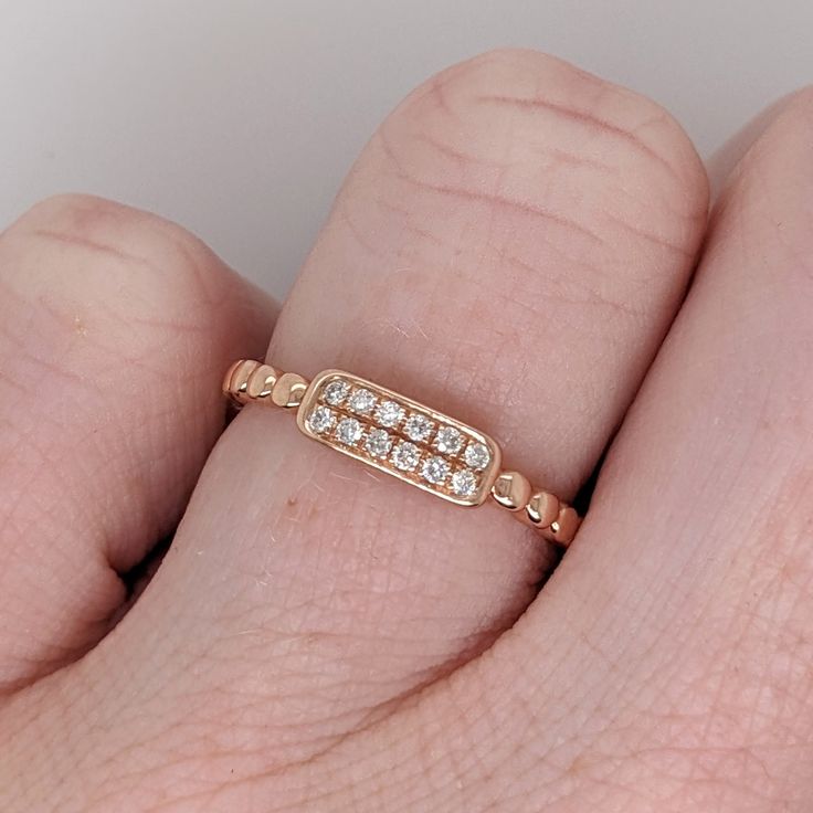 A beautiful diamond ring in 14k solid gold that can sit with your ring perfectly, or be worn on its own! 14k Rose Gold Diamond Cut Ring As Gift, 14k Rose Gold Diamond Ring, Dazzling 14k Gold Stackable Rings For Promise, Dazzling 14k Gold Stackable Promise Rings, Fine Jewelry 14k Rose Gold Diamond Ring, 14k Rose Gold Diamond Ring Fine Jewelry, Rose Gold 14k Cluster Ring With Single Cut Diamonds, Rose Gold Cluster Ring With Single Cut Diamonds, 14k Rose Gold Birthstone Ring With Diamond Accents