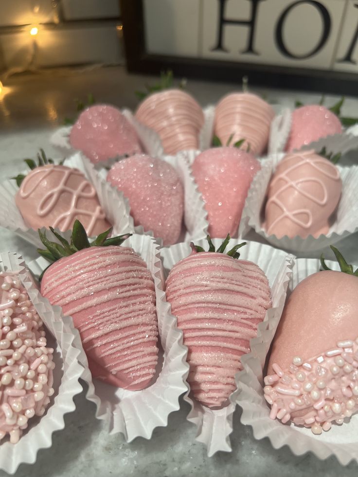 chocolate covered strawberries in pink and white wrappers