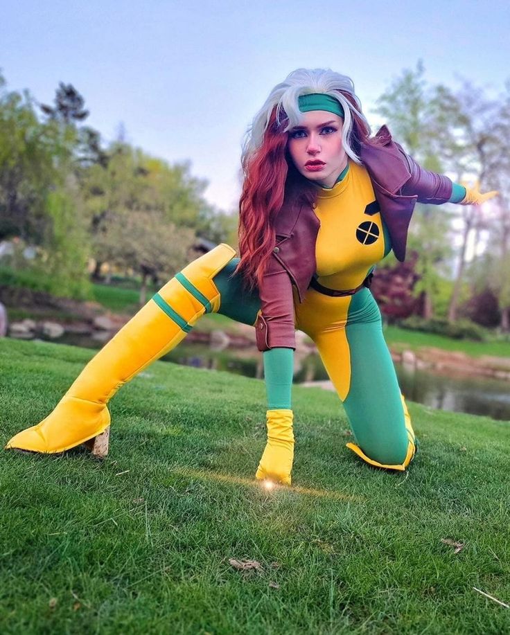 a woman dressed in yellow and green poses for the camera