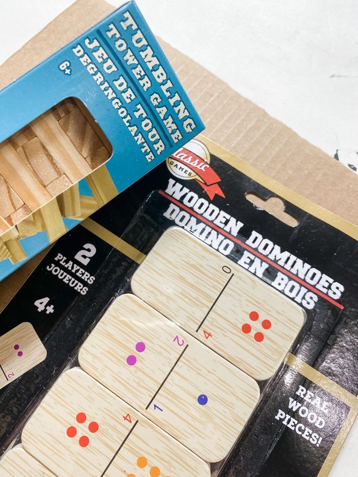 the wooden dominos board is in its box and ready to be used as a game