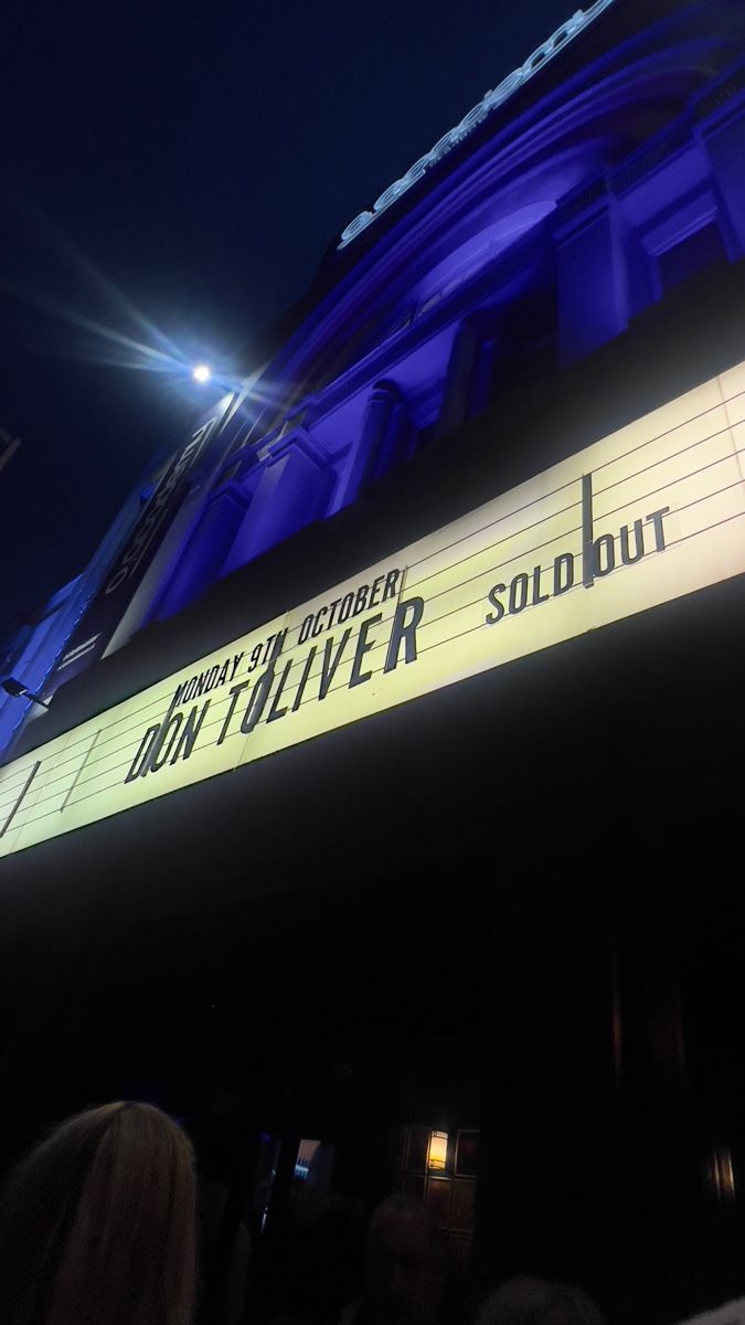 a large sign on the side of a building that says, don't touch silver sold out