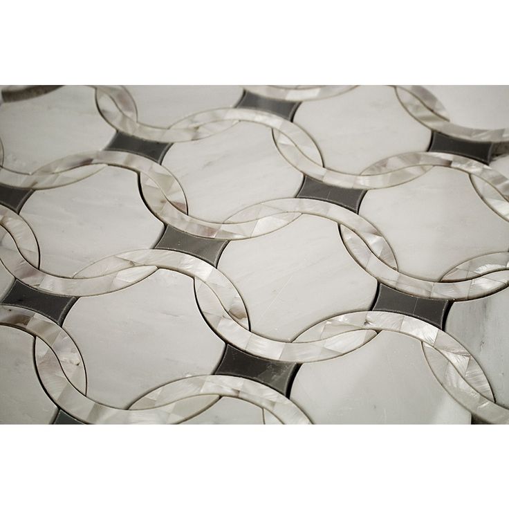 a close up view of a glass tile with circles and rings on it's surface