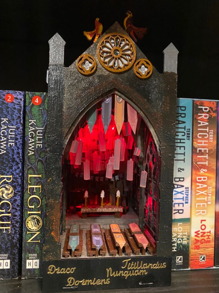 a book shelf filled with lots of books and a clock on it's side