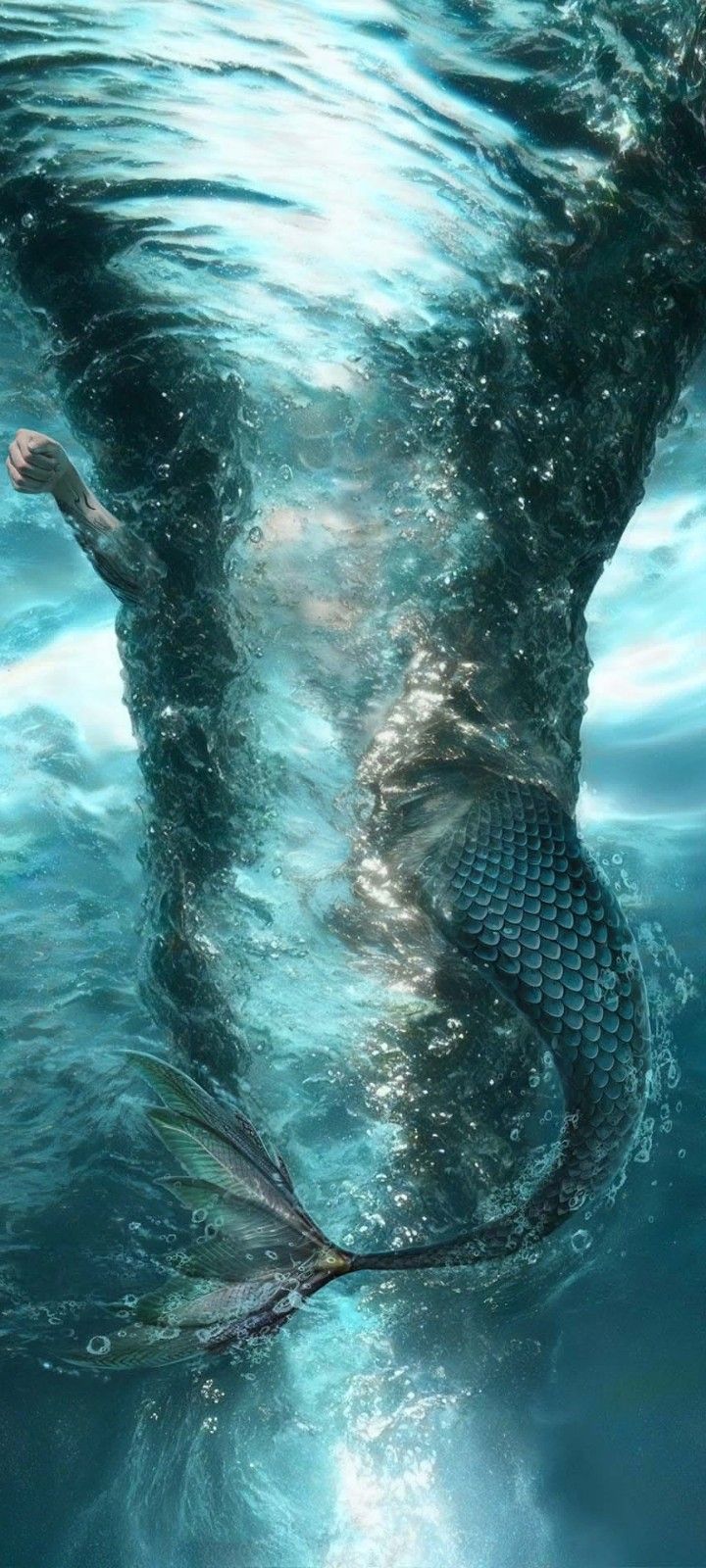 an image of a mermaid swimming in the water with her tail curled up and it's back turned to the camera