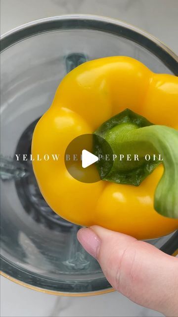 yellow bell peppers in a blender being held up by someone's hand with the words below it