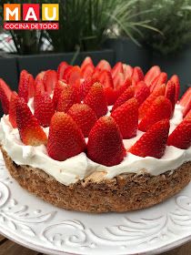 a cake topped with strawberries on top of a white plate