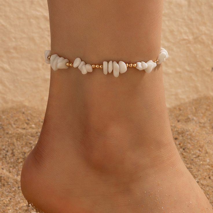 Embrace Your Bohemian Spirit Step into the warm embrace of summer with our Boho Shell Charm and Crushed Stone Anklet Set. Perfectly crafted to enhance your beach attire, this set of anklets brings a touch of bohemian elegance to any outfit. Whether you're strolling along the seashore or dancing under the stars, these anklets add a fashionable flair that celebrates your free-spirited style. Product Features Each anklet in this set is a showcase of thoughtful design and craftsmanship. Made with a Bohemian Ankle Wrap Jewelry For The Beach, Bohemian Ankle Wrap Jewelry For Beach, Hippie Ankle Wrap Anklets For Summer, Bohemian Anklets For Vacation, Bohemian Beach Anklets, Hippie Beach Ankle Wrap Anklets, White Ankle Wrap Anklets For Beach, Bohemian Bracelets For Spring, Trendy Anklets For Spring Vacation