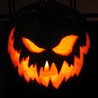 a carved jack o lantern with glowing eyes