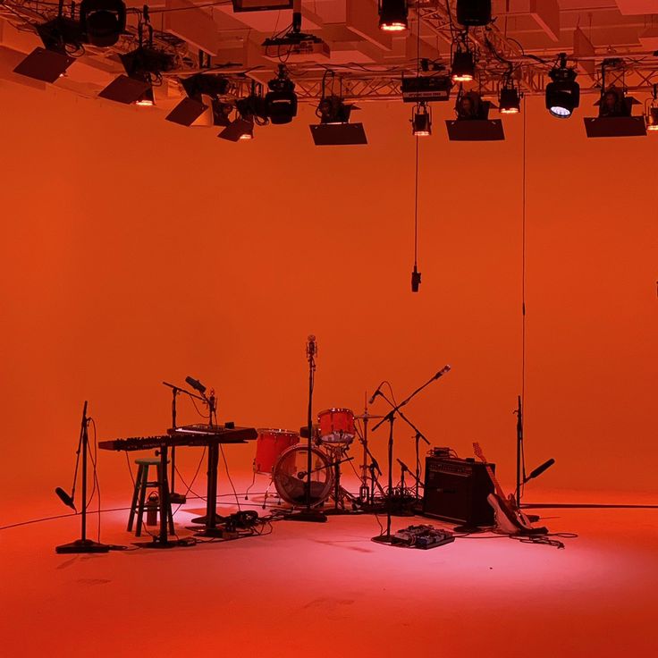 an orange room with musical instruments and lights