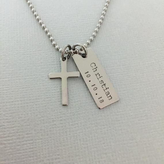 Personalised Boy Baptism Necklace, Men First Communion Necklace, Baby Boy Cross Necklace, Christening Gift, Little Boy Name Necklace ♥Please be sure to drop a name ( max. 9 letters ) and date in the note box at checkout.♥ This listing includes:. 9 x 25mm stainless steel bar tag. 12 x 20mm stainless steel cross charm. High quality stainless steel chain with lobster clasp. Comes in our signature cotton pouch♥ Please review our shop policies before orderinghttps://www.etsy.com/au/shop/AnesandEve?re Engraved Silver Necklace For Baptism, Silver Engraved Necklace For Baptism, Customizable Cross Jewelry For Baptism, Personalized Wedding Cross Pendant Necklace, Personalized Cross Pendant Necklace For Baptism, Personalized Cross Necklaces For Baptism, Silver Name Jewelry For Baptism, Engraved Cross Pendant Necklace For Baptism, Engraved Cross Necklace For Baptism