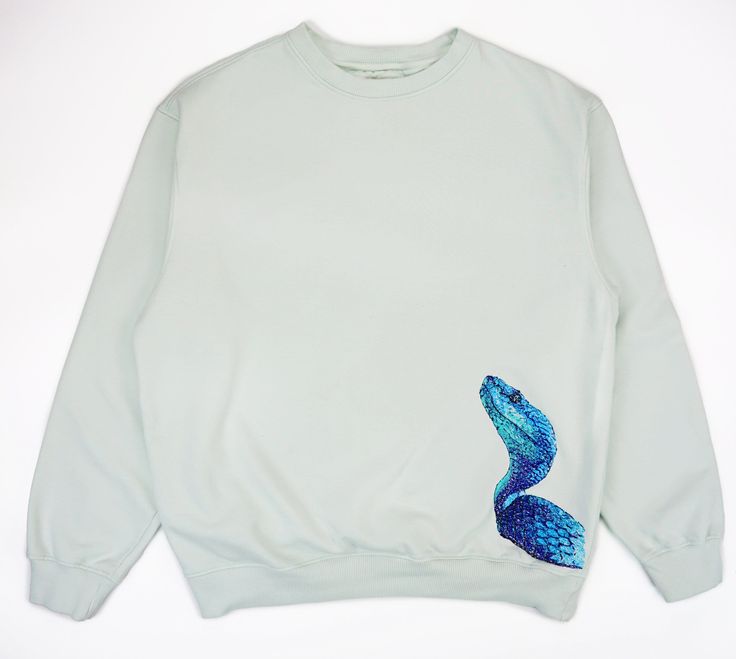 Completely embroidered Blue Viper in an abstract style on a sweater in Minty Green. Brushed Pure Organic Cotton 300GSM  which is a very luxurious feel - not your cheap quality sweaters! DELIVERY All items will be delivered within 5 working days. Harajuku style and Japanese art inspired design. We also have Japanese streetwear hoodies on sale! Everything we sell is from anime inspiration which enabled us to create anime shirts, anime hoodies, styled in japanese clothing. Thank you for checking our shop! Blue Viper, Quality Sweaters, Anime Inspiration, Anime Shirts, Japanese Clothing, Heavy Sweaters, Harajuku Style, Pet Sweater, Minty Green