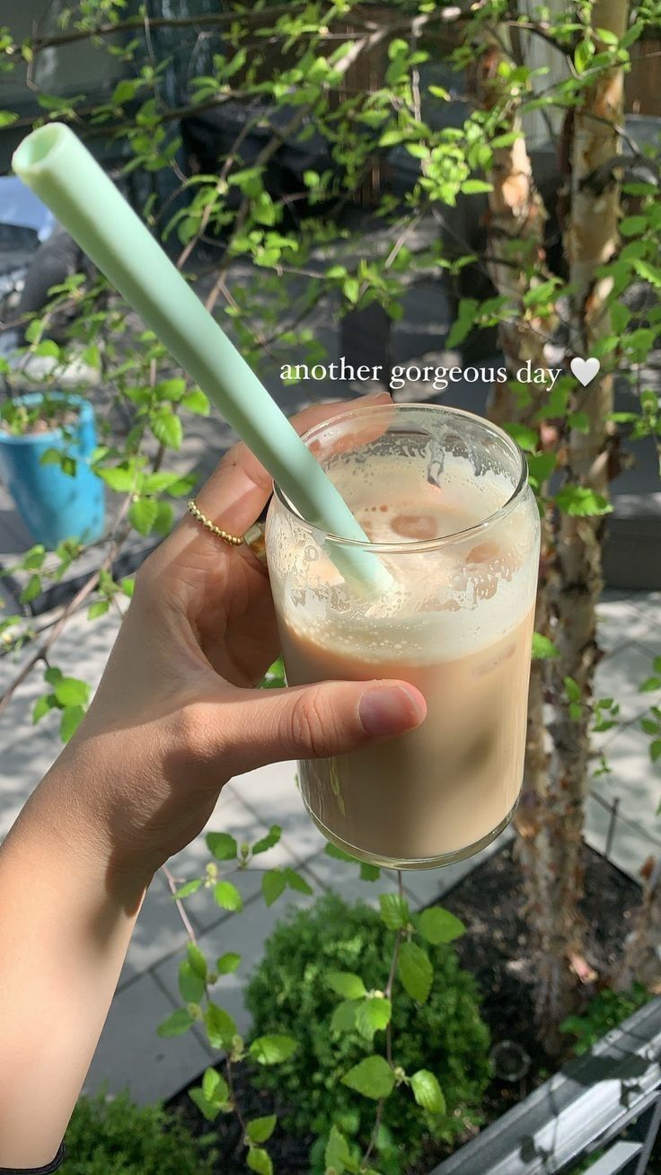 a person holding a drink with a green straw in it's hand and the caption reads, whatnothealth? another gorgeous day