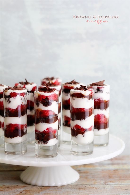 desserts are arranged on a cake plate