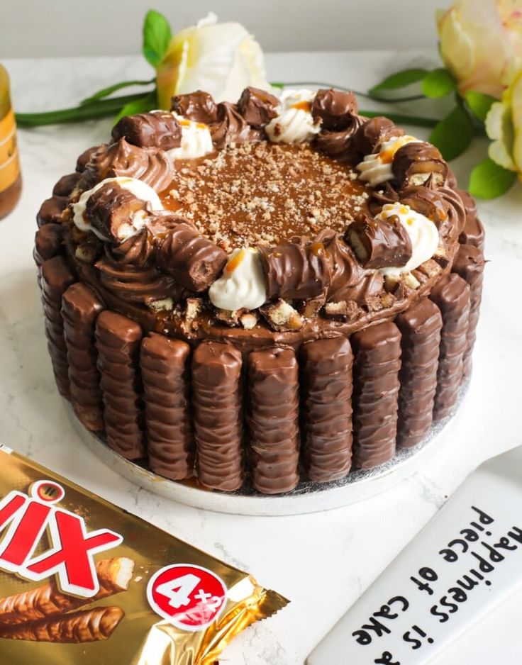 a chocolate cake sitting on top of a white table