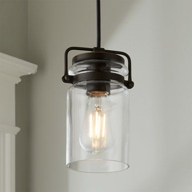 a light hanging from a ceiling fixture with two lights on each side of the bulb