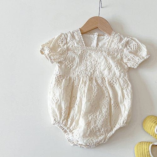 Introducing our adorable Ruffle Strap Baby Jumpsuit, a timeless and versatile piece that every new mom and baby will love. This jumpsuit combines style and practicality, ensuring both comfort and convenience for your little one. Featuring charming ruffled details at the shoulders and a gathered skirt, this jumpsuit exudes cuteness and adds a playful touch to your baby's wardrobe. The clever design creates the illusion of a two-piece outfit, with the jersey bodysuit seamlessly attached to the dre Cream Cotton Bubble Romper With Short Sleeves, Spring Playtime Onesie In Solid Color, Spring Playtime Solid Onesie, Spring Playtime Solid Color Onesie, Spring Playtime Plain Onesie, Cream Short Sleeve Bubble Romper For Summer, Cute Solid Color Spring Onesie, Spring White Ruffled Onesie, Solid Cotton Bodysuit With Ruffles