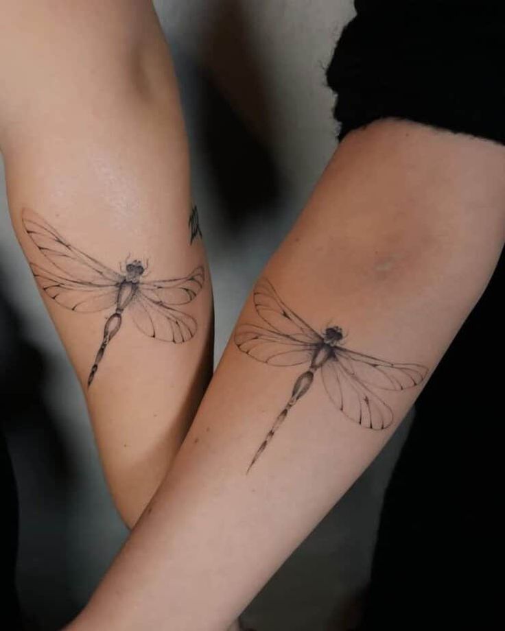 two tattoos on the arms of people that have dragonflies tattooed on their arm and legs