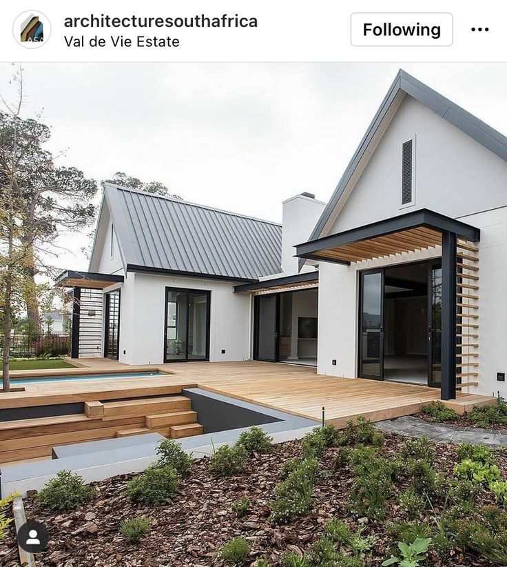 a white house with wooden steps leading up to it