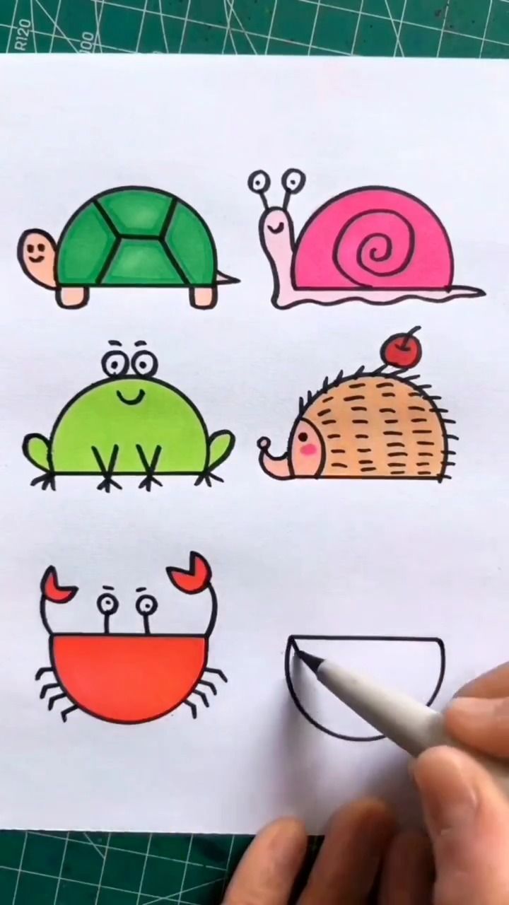 someone is drawing different types of animals on paper