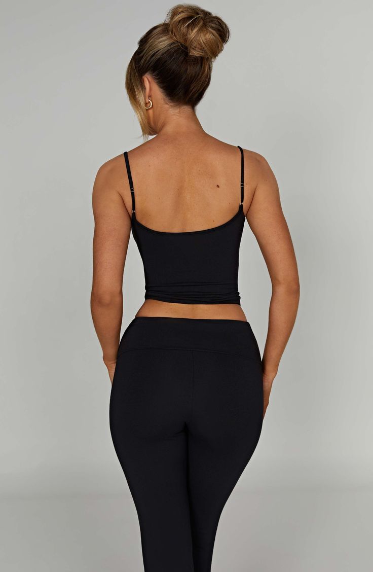 Keeping it simple has never looked so chic in the longline Marie tank top, part of our brand new category of buttery soft basics made in our premium modal fabric that moulds to your body like a second skin. This classic strappy design is contouring, comfy and looks amazing worn alone or paired with the Yazmin skirt and an oversized blazer.



Colour: Black.

Buttery soft, premium modal fabric.

Double layered.

Second skin feel.

Moulds to your shape.

Moves with your body.

Soft and stretchy.

Scoop neckline.

Classic tank top design.

Thin shoulder straps.

Longline length.

Model is an XS and is wearing an XS.

 Size: XS, S, M, L, XL, XXL Tank Top With Built-in Bra For Loungewear, Yoga Tops With Built-in Bra And Second-skin Fit, Chic High Stretch Tank Top With Built-in Bra, Workout Top With Built-in Bra And Second-skin Fit, Modal Tank Top With Built-in Bra For Loungewear, Trendy Sleeveless Activewear With Built-in Bra, Compressive Solid Tops Bra Friendly, Compressive Bra-friendly Camisole Top, Compressive Tank Top With Built-in Bra