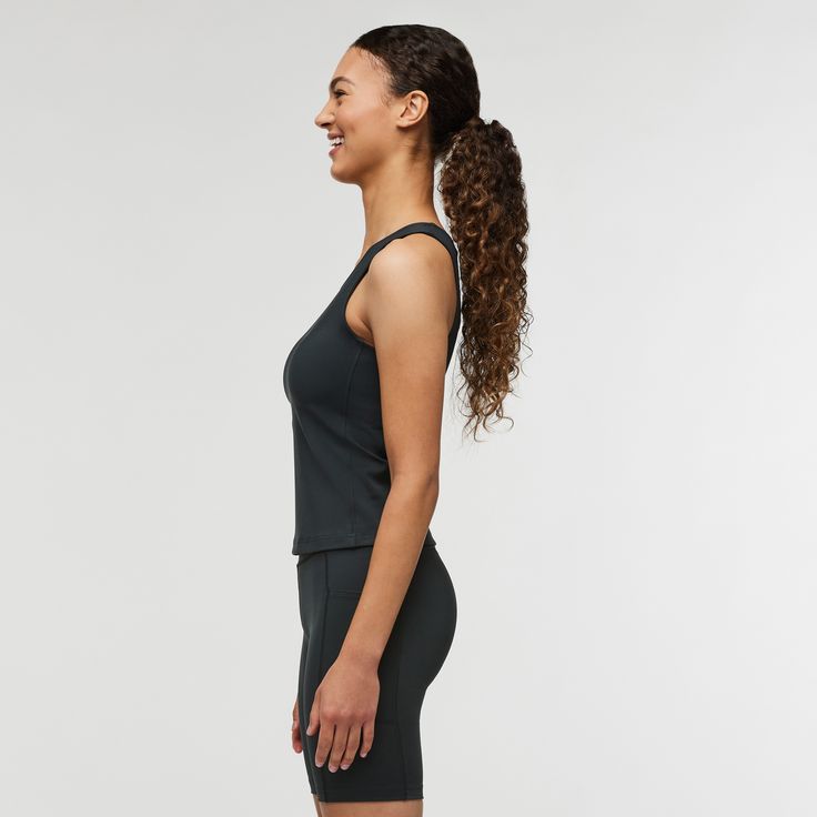 Featuring a unique recycled nylon-spandex blend that delivers comfortable compression, the Muevo Tank is built for movement. Designed to be worn over a sports bra, this fitted, breathable tank plays well with high-rise bike shorts or tights for your best adventures out there. | Cotopaxi Women's Muevo Tank in Cotopaxi Black | Size XS Black Fitted Activewear In Recycled Polyester, Fitted Functional Activewear With Seamless Construction, Functional Fitted Activewear With Seamless Construction, Recycled Polyester Racerback Sports Bra, Athleisure Black Sports Bra In Recycled Polyester, Black Stretch Sports Bra In Recycled Polyester, Functional Black Sports Bra In Recycled Polyester, Fitted Racerback Functional Activewear, Functional Black Sports Bra Made Of Recycled Polyester