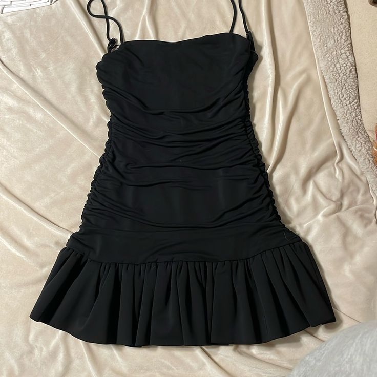 Zara Black Ruched Flare Dress (Never Worn!) Summer Black Mini Dress With Ruched Bodice, Summer Mini Dress With Ruched Bodice In Black, Black Mini Dress With Ruched Back For Summer, Black Mini Dress With Ruched Bodice, Black Ruched Back Dress For Spring, Black Mini Dress With Ruched Back And Spaghetti Straps, Spring Black Dress With Ruched Back, Black Mini Dress With Spaghetti Straps And Ruched Back, Zara Fitted Mini Dress With Ruffle Hem