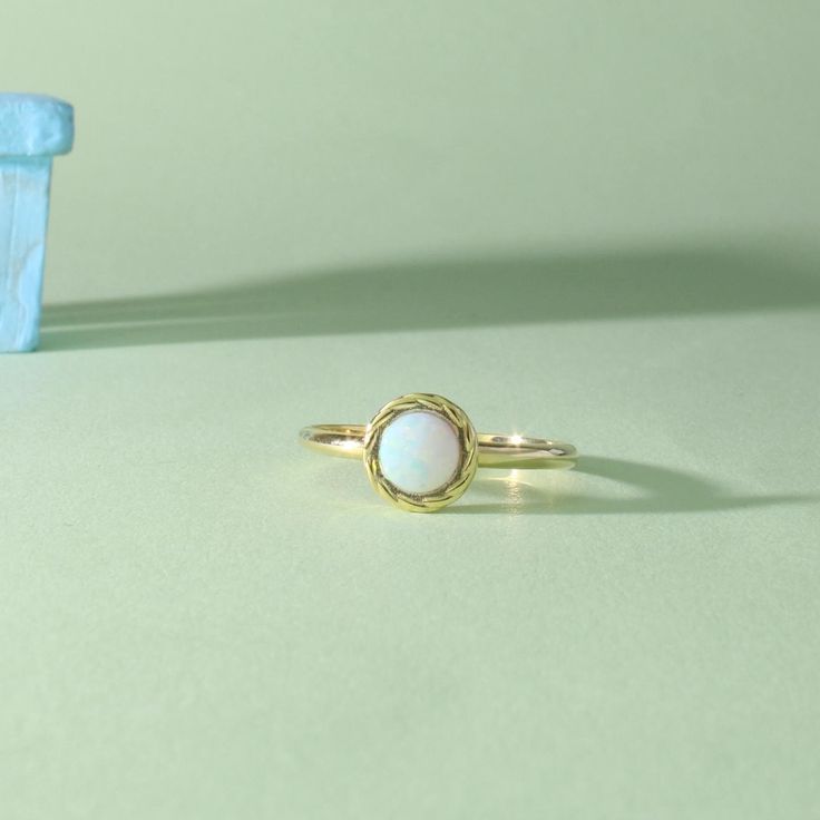 Gold Opal Ring Vintage Opal Ring Simple Opalite Ring White Gemstone Ring which has a simple, stylish and elegant design, is made of opal stone. A wonderfully elegant choice for Valentine's Day, birthdays and anniversaries that will attract attention day and night with its quality stone color and constant light reflection. ➤ Ring Details * 14K / 18K Yellow Gold or Yellow Sterling Silver * Gold Color Options; 14K / 18K White, Yellow, Rose Gold * Band Width: 1.70 mm * Thickness: 1.30 mm ➤ Gem Detai Stackable 14k Gold Opal Ring, Yellow Gold Stackable Opal Ring For Promise, Stackable Opal Ring In 14k Gold For Gift, 14k Gold Stackable Opal Ring For Gift, Simple Design Birthstone Ring In Fine Jewelry Style, Everyday Minimalist Round Opal Ring, Everyday Opal Ring With Round Shape, Minimalist 14k Gold Opal Ring With Round Band, Simple Round Birthstone Ring In Fine Jewelry Style