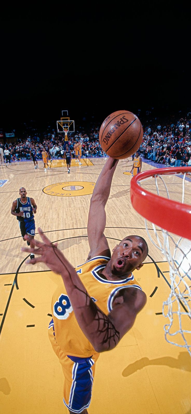 a basketball player dunking the ball into the hoop