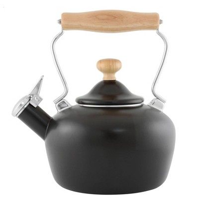 a black tea kettle with a wooden handle