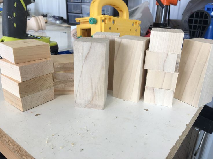 several pieces of wood sitting on top of a table