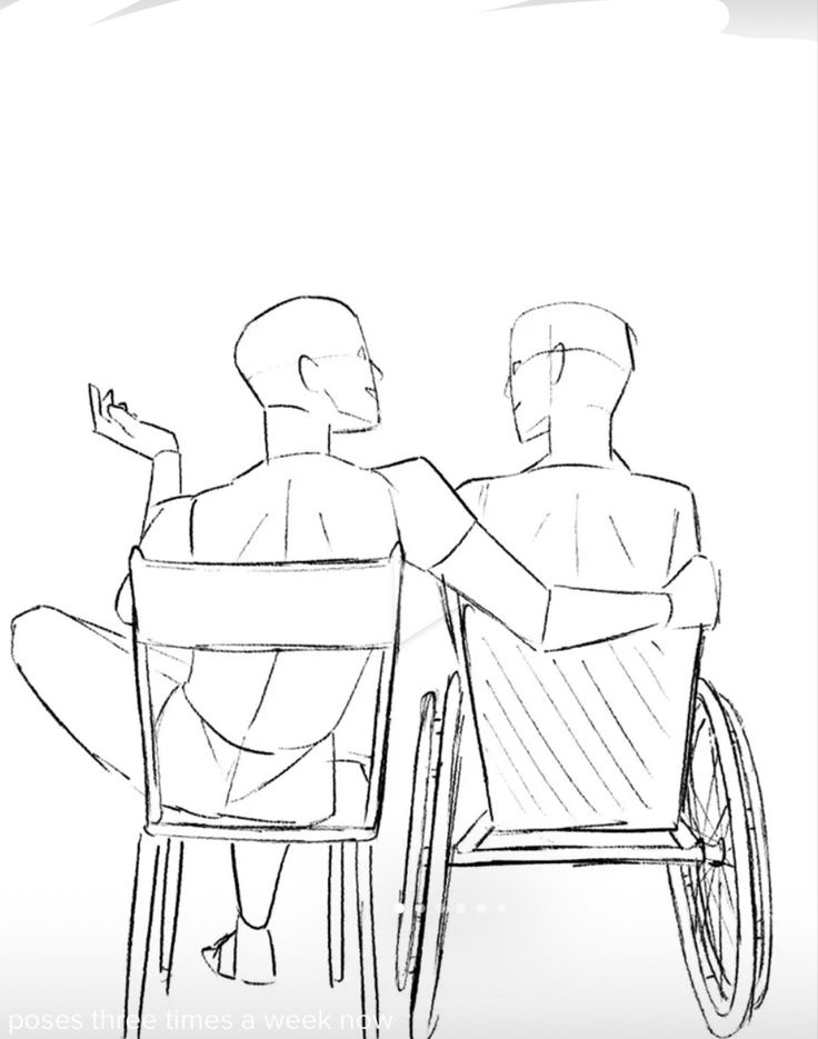 two people sitting in a wheel chair and one is pointing at something on the other side