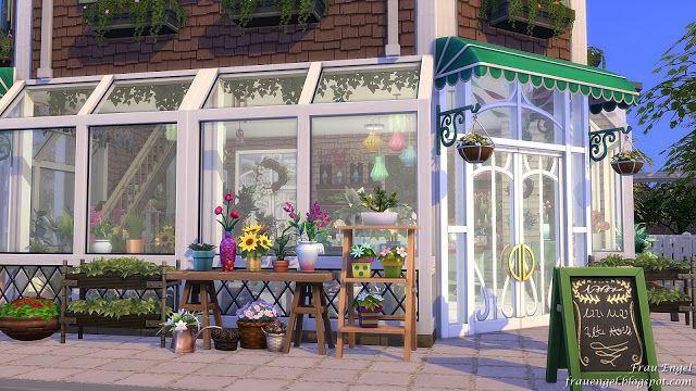 an animated image of a building with flowers on the outside and tables in front of it