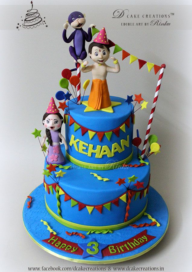 a blue birthday cake decorated with cartoon characters