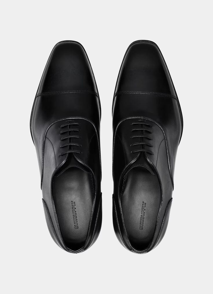 Black Oxford in Italian Calf Leather | SUITSUPPLY US Timeless Formal Dress Shoes With Leather Sole, Classic Tailored Dress Shoes With Leather Sole, Classic Wingtip Dress Shoes For Business Meetings, Business Oxfords With Leather Lining, Designer Oxfords With Leather Sole For Business, Luxury Business Dress Shoes With Goodyear Welt, Formal Fitted Oxfords With Leather Lining, Tailored Dress Shoes With Leather Sole For Business, Timeless Office Dress Shoes With Branded Insole